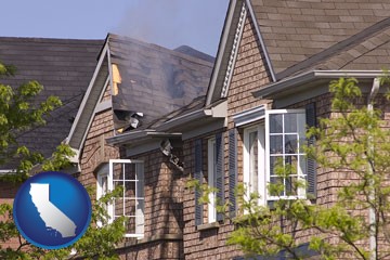 house fire damage with a smoldering roof - with California icon