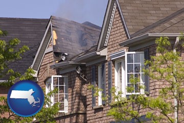house fire damage with a smoldering roof - with Massachusetts icon
