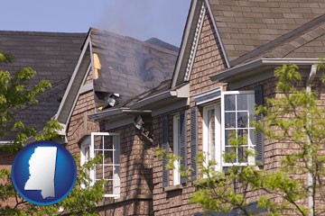 house fire damage with a smoldering roof - with Mississippi icon