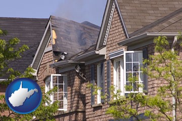 house fire damage with a smoldering roof - with West Virginia icon