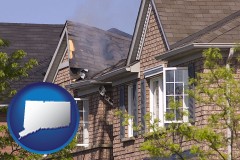 connecticut map icon and house fire damage with a smoldering roof