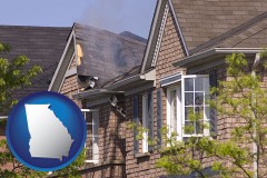 georgia map icon and house fire damage with a smoldering roof