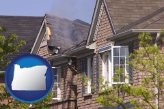 oregon map icon and house fire damage with a smoldering roof